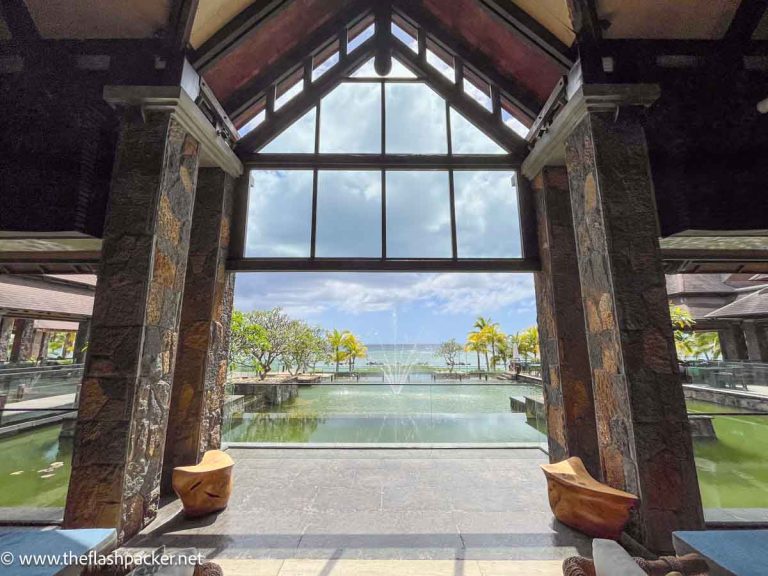 reception area of WESTIN TURTLE BAY hotel looking out to a pool and the ocean