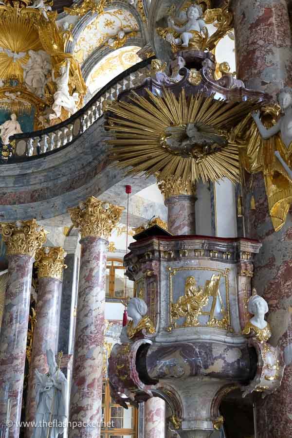 pulpit of chapel wurzburg residence with polychrome marble columns and gilded ceiling