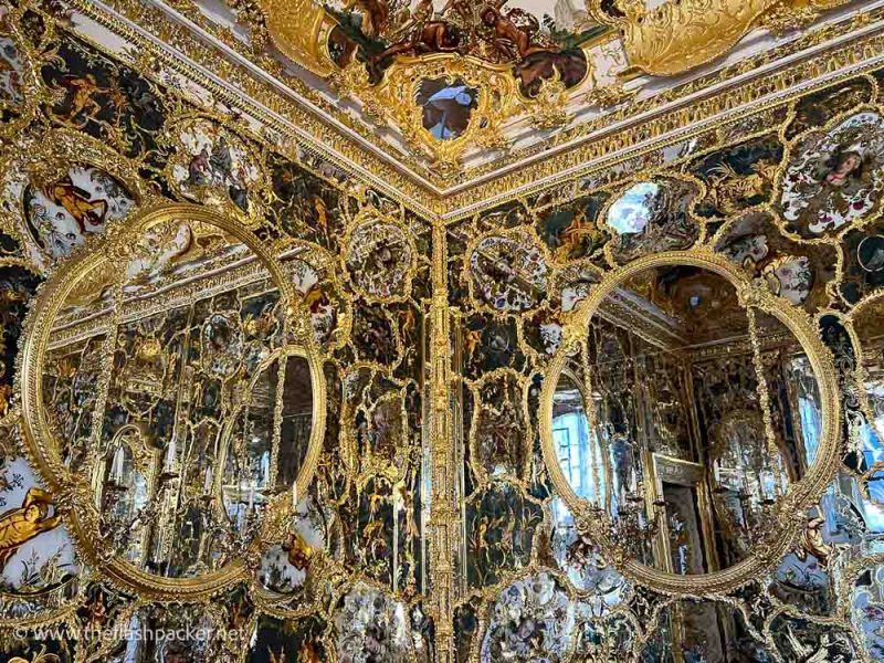 gilded mirrors on the walls of a room in wurzburg residence