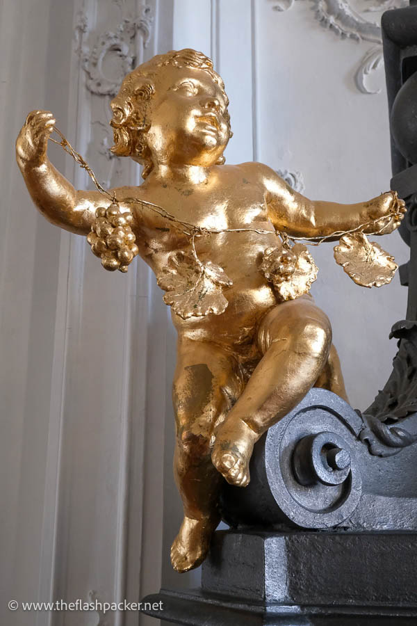 gilded sculpture of a cherub