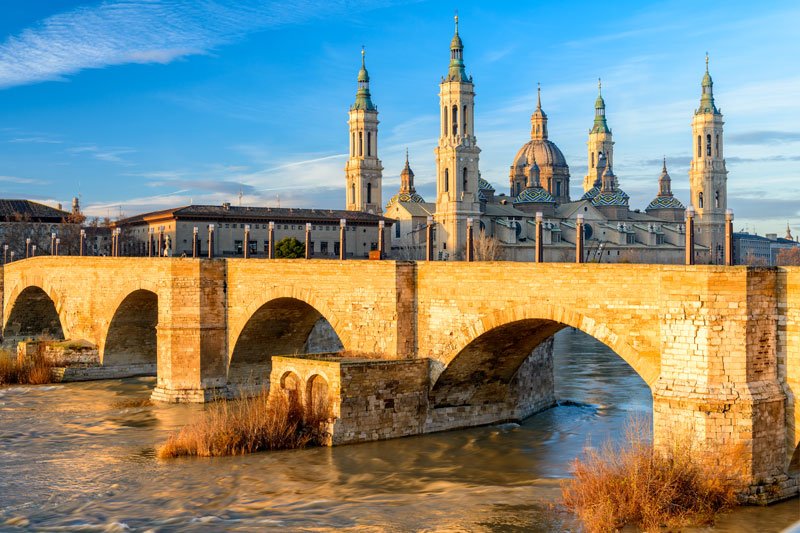 domes and spires of basilica nd stone bridge in zaragoza a beautiful city in spain